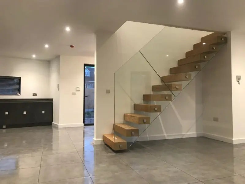 Replacing Spindles with Glass on Staircases: Pitch Angles, Clamps, and Tolerances